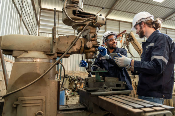 istock Team of engineers practicing maintenance Taking care and practicing maintenance of old machines in the factory so that they can be used continuously. 1457041281