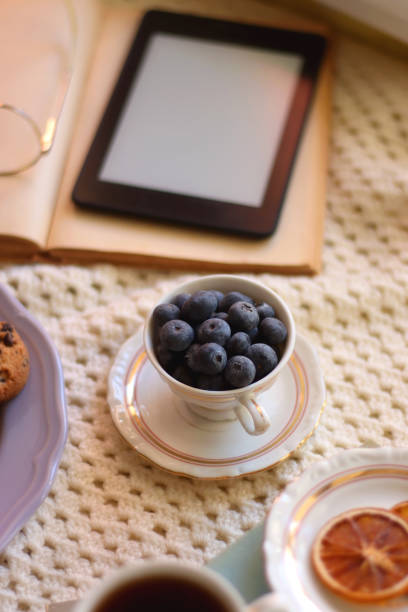 istock Tea, Books, Tablet, Cookies and Candles 1457045725