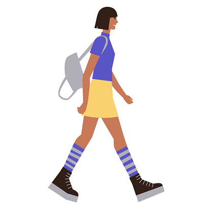 Girl is walking with a backpack. A young woman in a skirt and with a short haircut is walking. A modern teenager. Flat style. Vector illustration isolated on white.