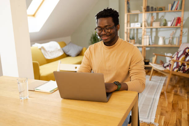 istock African American young man freelancing at home 1457047284