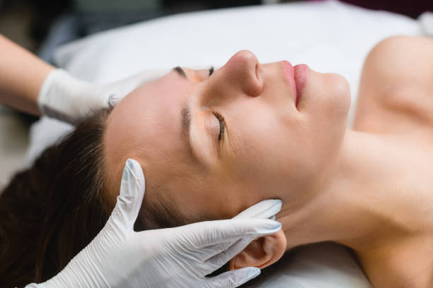 istock Beauty massage treatment to forehead face skin 1457048329