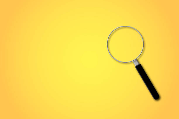 istock Magnifier or magnifying glass with light on yellow background. Search, discovery, research. 1457048537