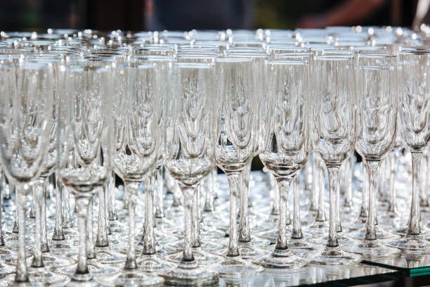istock Empty glass transparent wine glasses on a table, catering background concept 1457051134