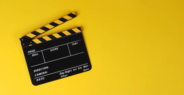 istock Yellow clapper board or movie slate on yellow background. 1457052974