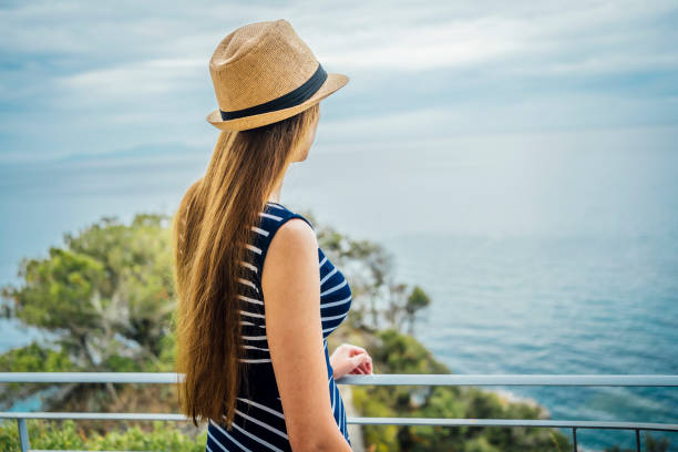 istock Woman enjoying the sea view 1457053299