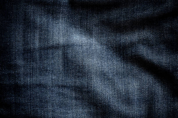 jeans denim texture close-up - spijkerbroek stockfoto's en -beelden