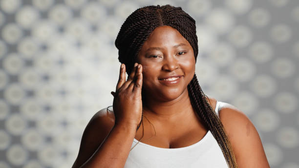 istock African american model applying anti aging face cream 1457055777