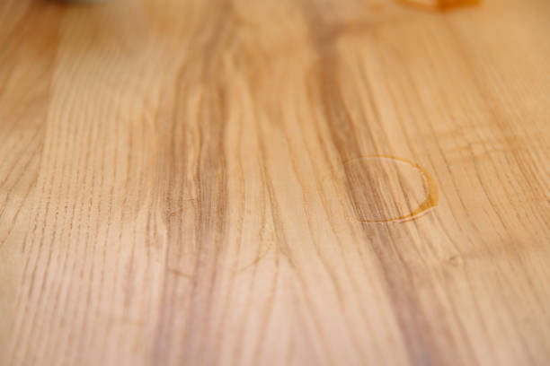 istock Two wet prints from under a cup of coffee on a wooden table. 1457056325