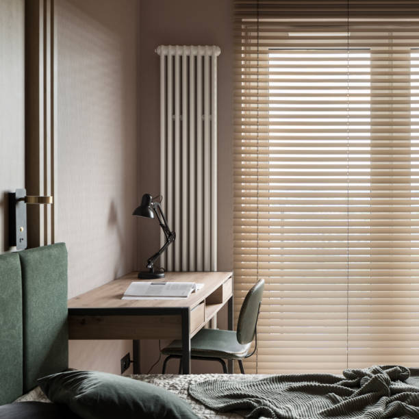 istock Desk, bed and big window in bedroom 1457056473