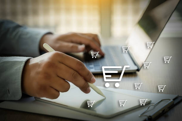 istock e-commerce shopping man phone and laptop using shopping E-commerce Internet Global Marketing Purchasing 1457057354