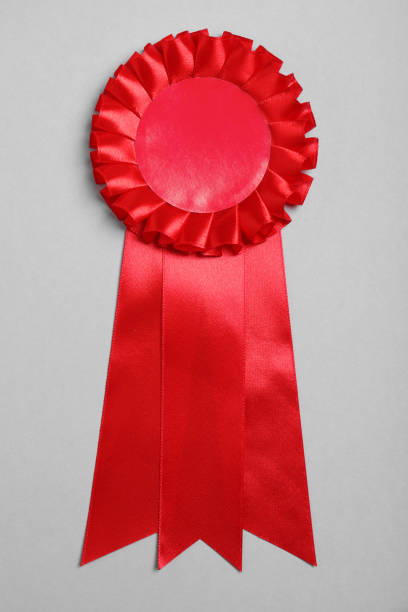 istock Red award ribbon on grey background, top view 1457064270