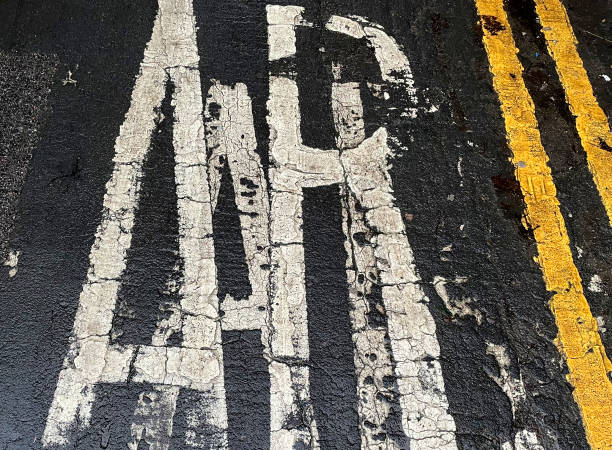 Old road markings in the rain