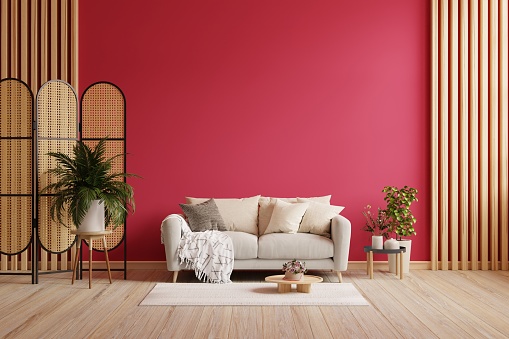 Livingroom in trend viva magenta wall background mockup with sofa furniture and decor.3d rendering