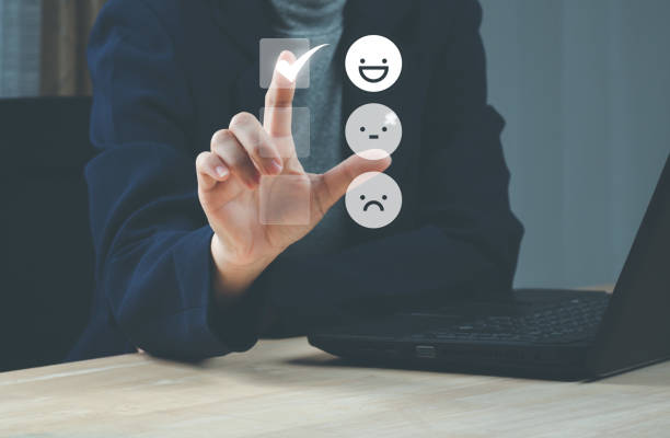 istock Satisfaction and Customer service concept ,Business people are touching the virtual screen on the happy Smiley face icon to give satisfaction in service. rating very impressed. 1457065204