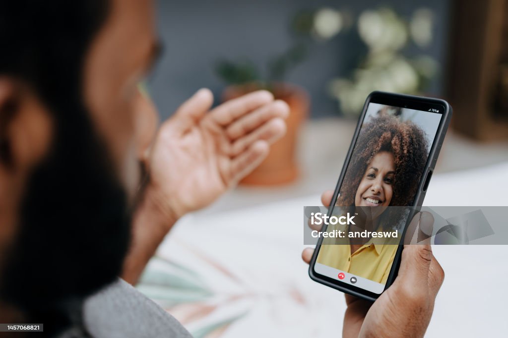 Video conference via smartphone Using Phone Stock Photo