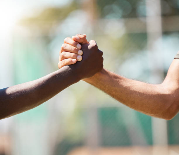 istock Handshake, partnership and agreement for trust, support or unity against a blurred background. People shaking hands for teamwork, friendship or deal in meeting, respect or social greeting on mockup 1457070823