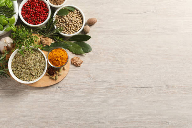 istock Different herbs and spices on wooden table, flat lay. Space for text 1457071188