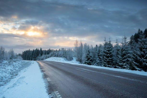 istock road in winter countryside at sunrise 1457073741
