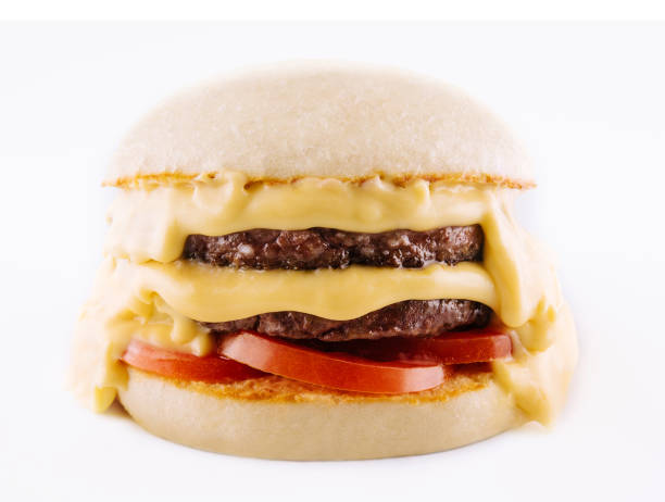 istock hamburger with two cutlets, tomatoes and melted cheese 1457076383