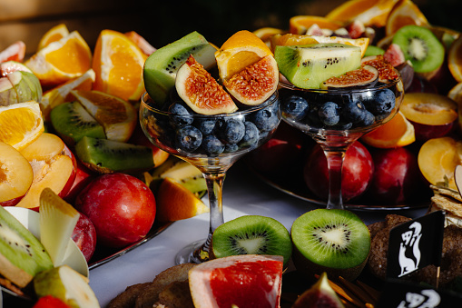 fruit in a glass, salad made from tasty and exotic fruits
