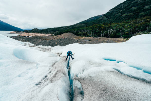 Flowing blue ice cascades down a glacier's side