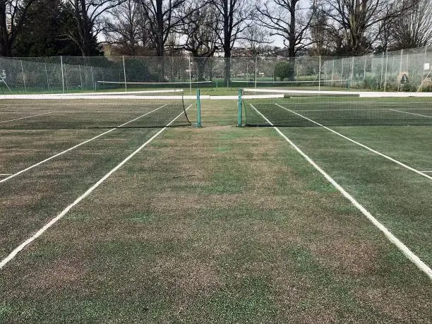 Empty outdoor tennis court. Captured in Preston Park in Brighton on the 15 January 2023.