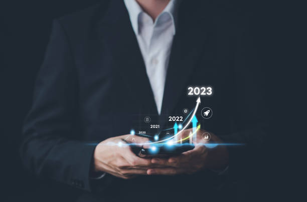 istock Business growing in 2023. Businessman hand typing smartphone with virtual increasing technical graph and up arrow for trader analysis. Stock, Cryptocurrency chart trader, trading, investment. 1457080002