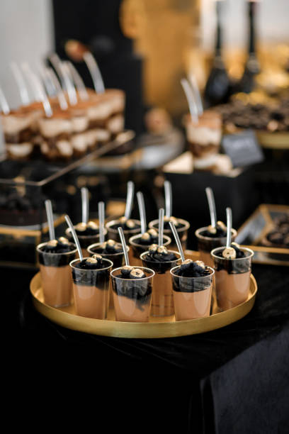 istock Sweet luxury candy bar on table in restaurant in black tone. Cakes and other sweets 1457081380