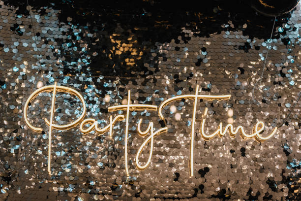 istock Happy New Year 2023. Silver photo booth with decor shiny and led strips with text party time. Zone with sparkling sequins. Light blur background for wedding. A place for congratulations for birthday. 1457086621