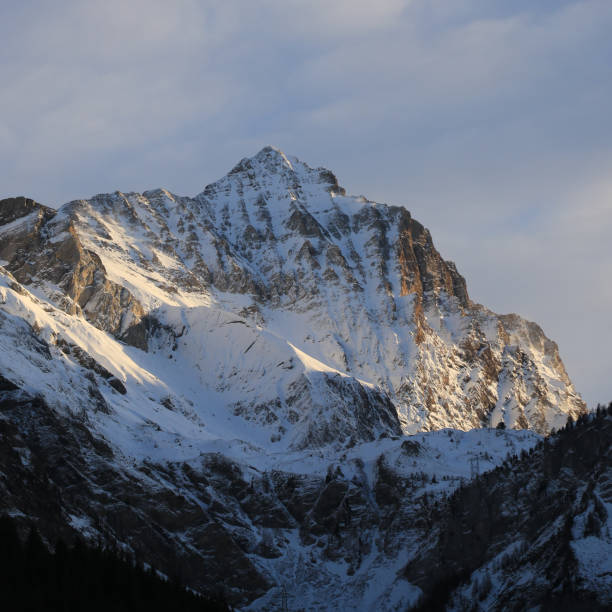 istock Sun lit peak of Mount Arpelistock, Switzerland. 1457087681