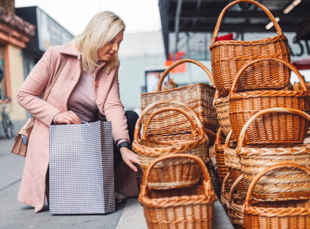 istock Young womans in front of a shopping centre 1457089749