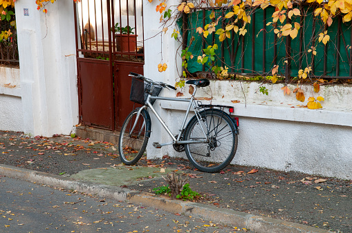 Bicycle standing at the entrance of a house