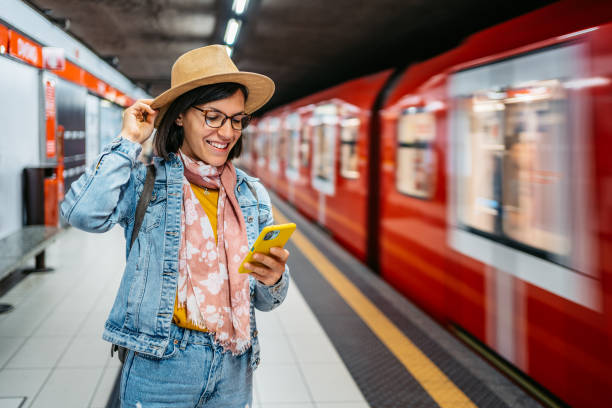 istock Young Woman Using Phone In A Subway Station 1457094655