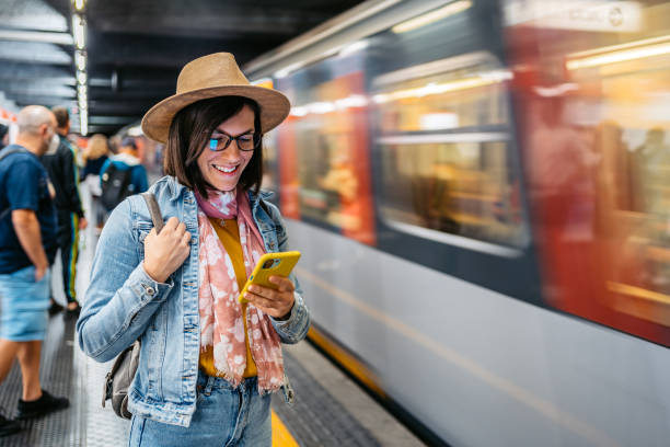 istock Young Woman Using Phone In A Subway Station 1457094936