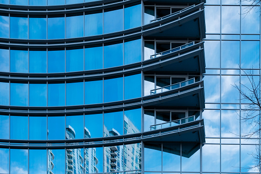 Angular balconies and mirrored windows on high rise in Charlotte, North Carolina.