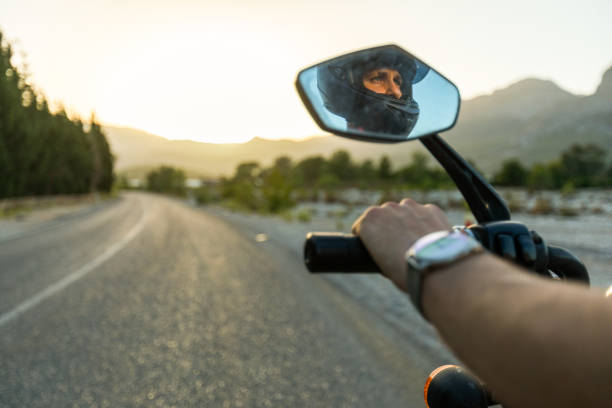 Man in the rearview mirror of a motorcycle
