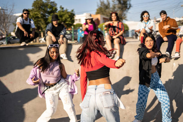 istock Friends dancing and having fun during street party 1457097073