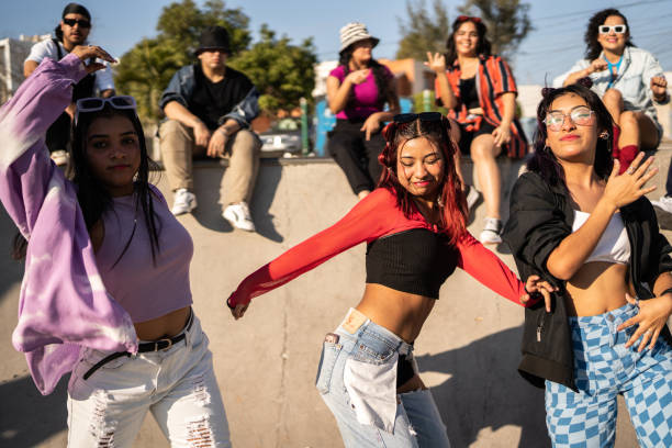 istock Friends dancing and having fun during street party 1457097078