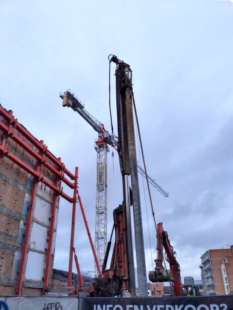 Leuven Diestse street new residential flat project Leuven, Flemish-Brabant, Belgium - January 16, 2023: rotary drilling tube excavating earth in depth to find a stale foundation surface for sale sign information sign information symbol stock pictures, royalty-free photos & images