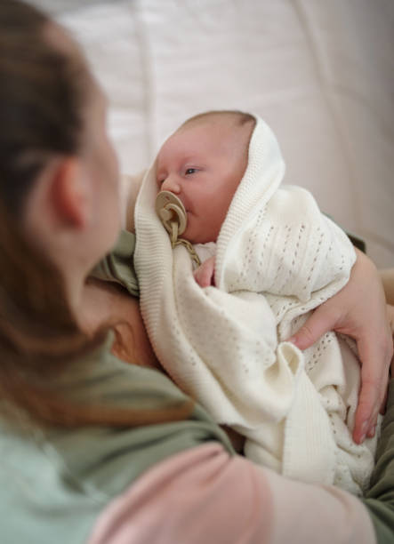 istock Loving mother with her 1 mounth baby boy 1457098323