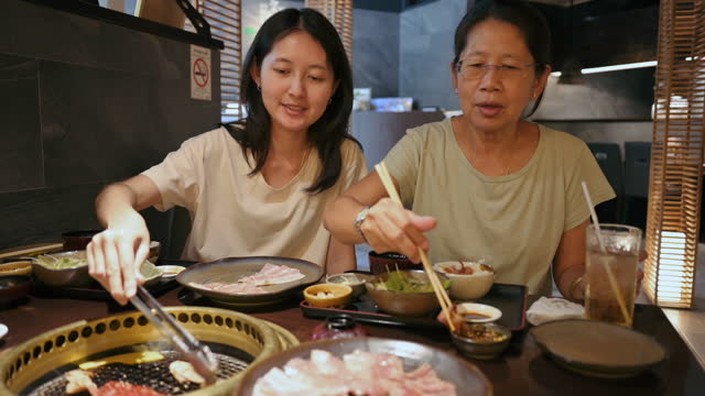 Happy family enjoy luxury beef japanese style buffet in restaurant