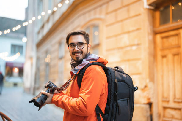 istock Traveller taking photograph in town 1457100581