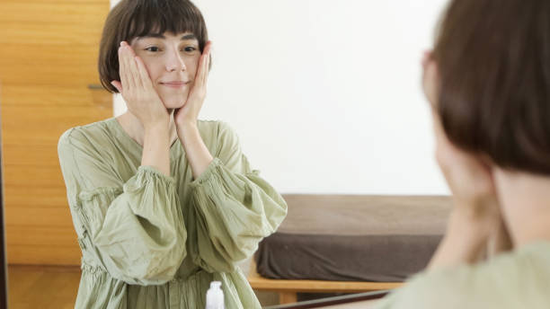 istock Young diverse woman cleaning her face before applying makeup 1457101478