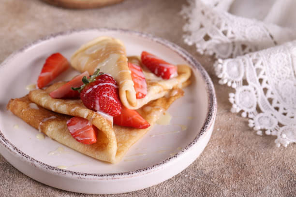 istock homemade thin pancakes with fresh strawberries 1457102728