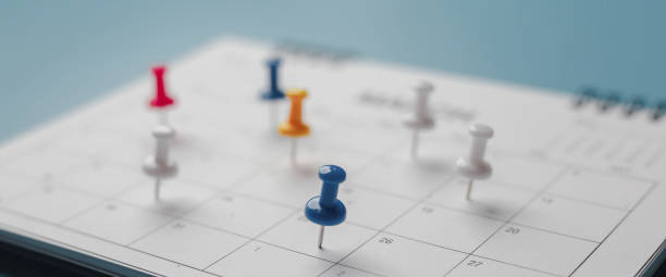 istock Embroidered red pins on a calendar event Planner calendar,clock to set timetable organize schedule,planning for business meeting or travel planning concept. 1457103567