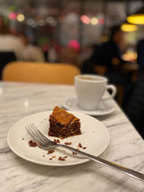 istock Leftover Bitten Brownie at Cafe Restaurant with Coffee. 1457103651