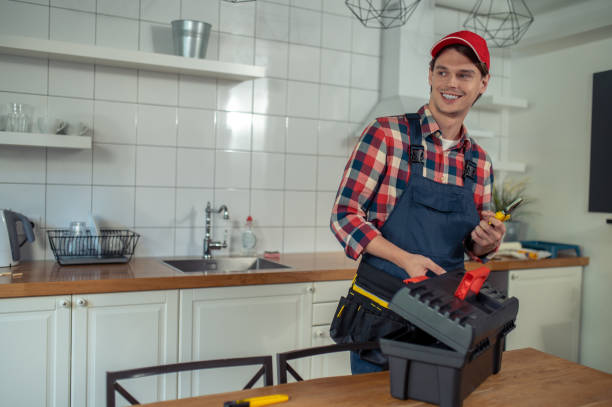 istock Cheerful repair technician preparing for work in a client apartment 1457104210