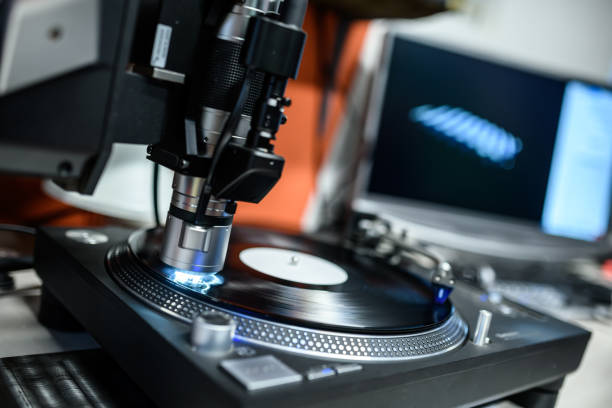 istock Vinyl Record Printing Pressing Plant, Quality control with microscope 1457104301