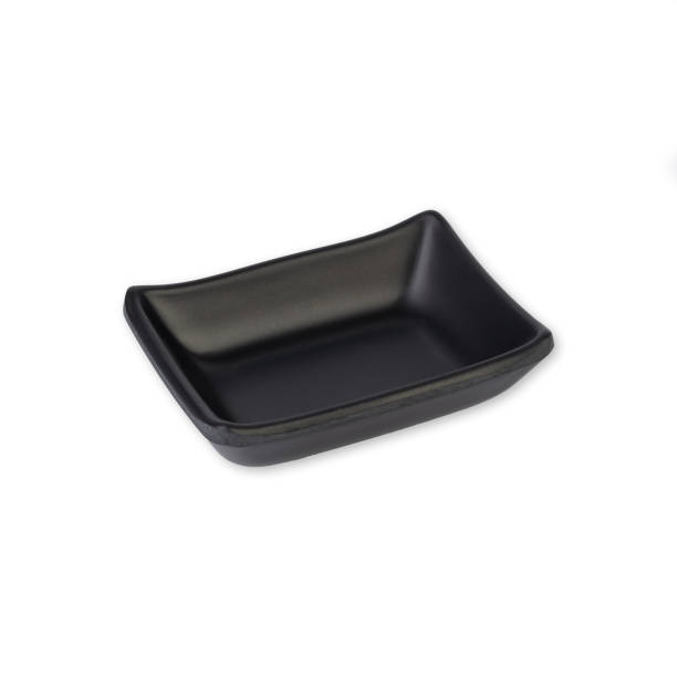 istock Small black ceramic plate isolated over white background 1457105550