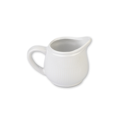 White ceramic milk pitcher isolated over white background.
